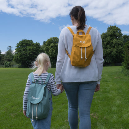 Mustard and Sage Green Personalised Mini Rucksacks available at thepersonalisedgiftcompany.com