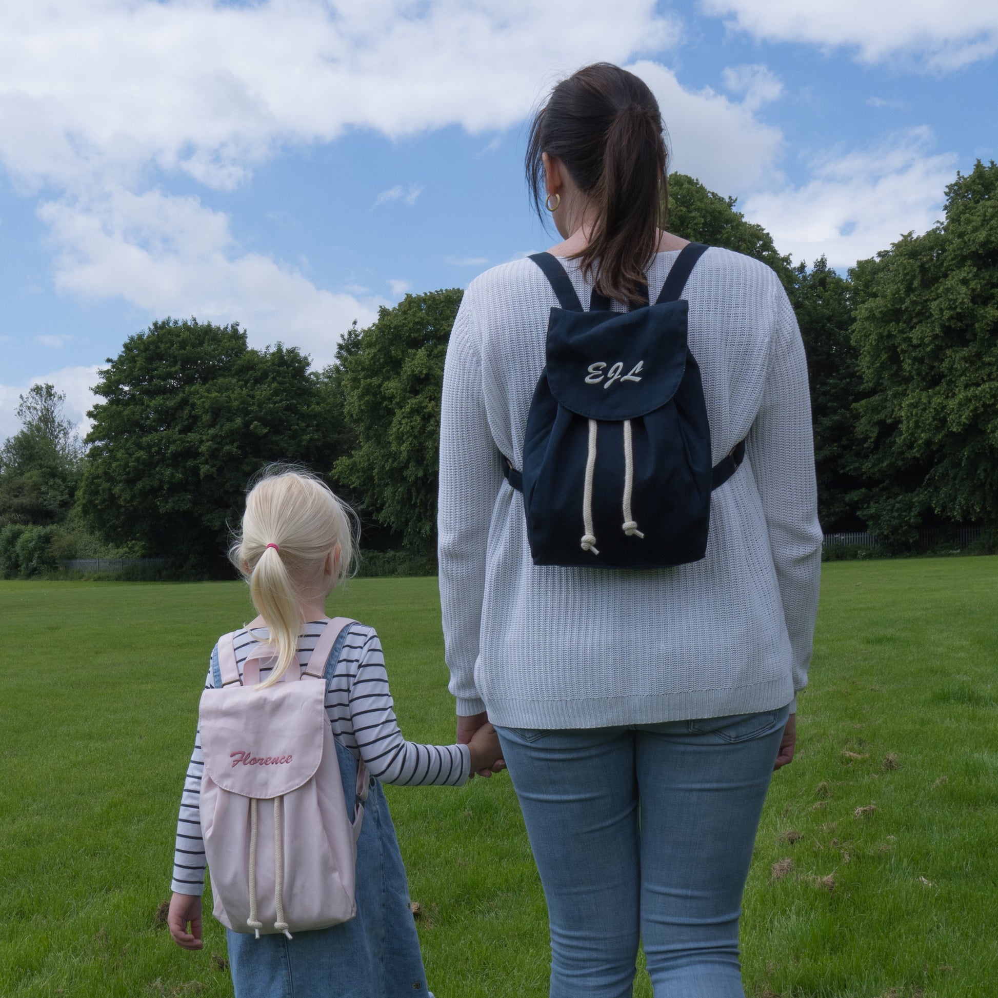 Pink and Navy Blue Personalised Mini Rucksacks available at thepersonalisedgiftcompany.com